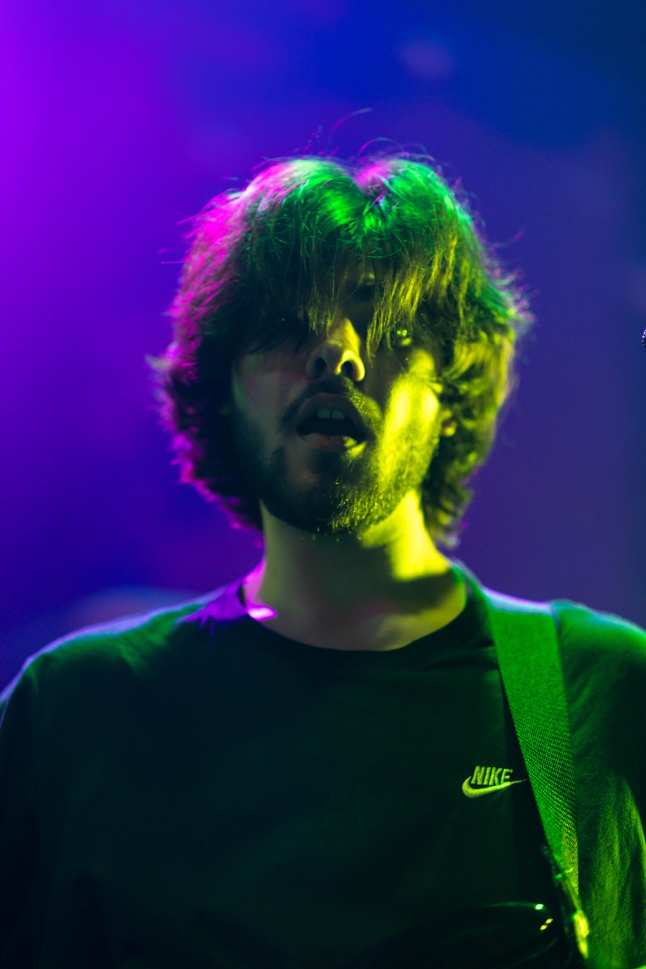Zoning Out performing under green and purple stage lights